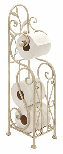 Decorative wrought iron toilet paper holder with rolls.