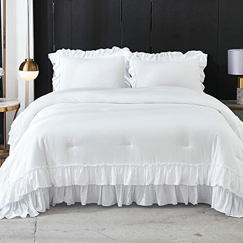 White ruffled bedding set with pillows and lamps