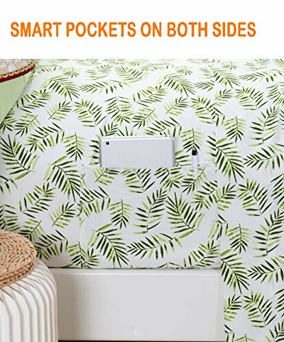 Bed sheet with green leaf pattern and side pockets holding a tablet and pen.