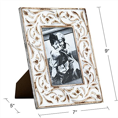 Ornate white photo frame with floral design and vintage photo of two children.