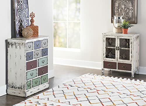Vintage-style cabinets and decor in a well-lit room with a patterned rug.